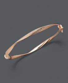 Capture the must-have trend of the season with simple style in caramel color. Bangle features a subtle twist and textured finish in chic 14k rose gold. Approximate diameter: 2-3/8 inches.