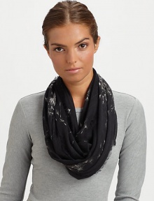 A muted skull print gets lost amongst flying dandelions on this ultra-soft pashmina wrap with eyelash fringe.90% modal/10% cashmereAbout 55 X 55Dry cleanMade in Italy