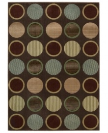 Design that's spot on. This marvelously modern area rug bursts forth from your floor with row upon row of textured circles, presented in appealing colors on a deep chocolate ground, and hand-carved to add that extra, eye-catching dimension.