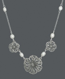 Create a neckline-embracing frame in intricate floral. It's easy to spruce up your spring wardrobe with this effortless style from Genevieve & Grace. Three filigree flowers glimmer with the addition of marcasite and shimmery cultured freshwater pearl accents (4-6 mm). Set in sterling silver. Approximate length: 17 inches. Create a neckline-embracing frame in intricate floral. It's easy to spruce up your spring wardrobe with this effortless style from Genevieve & Grace. Three filigree flowers glimmer with the addition of marcasite and shimmery cultured freshwater pearl accents (4-6 mm). Set in sterling silver. Approximate length: 17 inches.