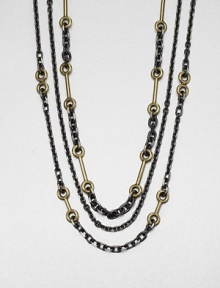 A two-tone design featuring link chains in various sizes accented with antique-finished brass links. HematiteAntique-finished brassLength, about 30Lobster clasp closureImported A two-tone design featuring link chains in various sizes accented with antique-finished brass links. HematiteAntique-finished brassLength, about 30Lobster clasp closureImported