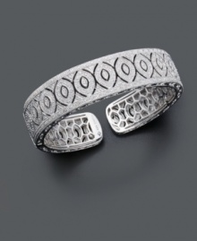 Slip on style with extraordinary sparkle. This dazzling milgrain bangle slides easily over the wrist and features an open-cut oval design covered in sparkling diamond (1/2 ct. t.w.). Bracelet crafted in sterling silver. Approximate diameter: 2-1/2 inches. Slip on style with extraordinary sparkle. This dazzling milgrain bangle slides easily over the wrist and features an open-cut oval design covered in sparkling diamond (1/2 ct. t.w.). Bracelet crafted in sterling silver. Approximate diameter: 2-1/2 inches.