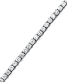Match point. A seamless row of round-cut diamonds (6 ct. t.w.) epitomize perfection in this stunning tennis bracelet. Crafted in 14k white gold. Approximate length: 7-1/4 inches. Match point. A seamless row of round-cut diamonds (6 ct. t.w.) epitomize perfection in this stunning tennis bracelet. Crafted in 14k white gold. Approximate length: 7-1/4 inches.