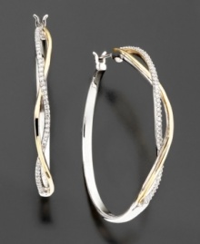Beautiful classic diamond hoops with a twist. These diamond earrings feature sparkling round-cut diamonds (1/5 ct. t.w.) set in 14k gold and sterling silver. Approximate diameter: 1-1/8 inches. Beautiful classic diamond hoops with a twist. These diamond earrings feature sparkling round-cut diamonds (1/5 ct. t.w.) set in 14k gold and sterling silver. Approximate diameter: 1-1/8 inches.