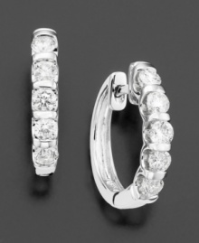 The perfect diamond earrings. Simple beauty emulates from a stunning row of channel-set, round-cut diamonds (1 ct. t.w.) set in pristine 14k white gold. The perfect diamond earrings. Simple beauty emulates from a stunning row of channel-set, round-cut diamonds (1 ct. t.w.) set in pristine 14k white gold.