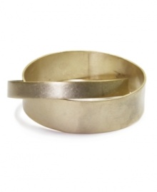 Lock in fabulous style with Jones New York's interlocked bangle. Bracelet crafted from two bands of gold-plated mixed metal. Approximate diameter: 2-3/4 inches.