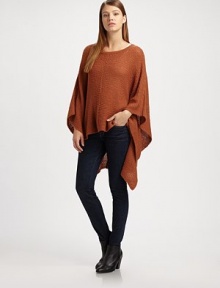 Long poncho sleeves and an emphasized hi-lo hem update this soft, woven boatneck sweater. BoatneckDropped shouldersLong poncho sleeves85% acrylic/15% nylonHand washImportedAdditional Information Women's Premier Designer & Contemporary Size Guide 