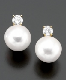 Classically beautiful jewelry with lasting style. These earrings feature cultured freshwater pearl (7-8 mm) and round-cut diamond (1/4 ct. t.w.) set in 14k gold. Classically beautiful jewelry with lasting style. These earrings feature cultured freshwater pearl (7-8 mm) and round-cut diamond (1/4 ct. t.w.) set in 14k gold.