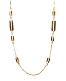 Neutral tones add a touch of warmth to your look. Lauren by Ralph Lauren necklace features trendy tortoise shell accents set in a delicate gold tone mixed metal chain. Approximate length: 36 inches. Neutral tones add a touch of warmth to your look. Lauren by Ralph Lauren necklace features trendy tortoise shell accents set in a delicate gold tone mixed metal chain. Approximate length: 36 inches.