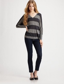 Bold stripes highlight this slouchy dropped-shoulder silhouette.V neckline Long sleeves Wide cuffs Pullover style About 25½ from shoulder to hem 85% viscose/15% wool Dry clean Made in USA of imported fabric