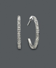 Treat yourself to a pair of versatile hoop earrings that can be worn day or night. Hoop earrings feature channel-set, round-cut diamonds (1/10 ct. t.w.) in a sterling silver setting. Approximate diameter: 3/4 inch. Treat yourself to a pair of versatile hoop earrings that can be worn day or night. Hoop earrings feature channel-set, round-cut diamonds (1/10 ct. t.w.) in a sterling silver setting. Approximate diameter: 3/4 inch.