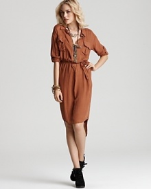 Take your look in a downtown direction with a Free People shirt dress. Featuring black and gold buttons, flap pockets and a high/low hem, this forward piece turns any day into a stylish event.