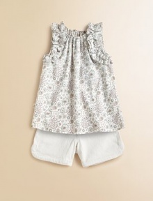 Fun pop-art flowers on woven cotton are adorably adorned with fluffy ruffles at the arm openings in an easy, edgy top.Elasticized gathered necklineSleeveless with ruffled trimKeyhole button-and-loop back closeSlight A-line shapeCottonMachine washImported Fun pop-art flowers on woven cotton are adorably adorned with fluffy ruffles at the arm openings in an easy, edgy top.Elasticized gathered necklineSleeveless with ruffled trimKeyhole button-and-loop back closeSlight A-line shapeCottonMachine washImported