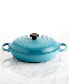 An innovative design with a flat base is the ideal space for poaching, searing, roasting, stir-frying and browning. Inspired by French braisers, this piece uses wet and dry heats to break down and tenderize even the toughest meats. Crafted of enameled cast iron, this piece distributes heat evenly and slowly and goes from oven to table with ease. Lifetime warranty. An innovative design with a flat base is the ideal space for poaching, searing, roasting, stir-frying and browning. Inspired by French braisers, this piece uses wet and dry heats to break down and tenderize even the toughest meats. Crafted of enameled cast iron, this piece distributes heat evenly and slowly and goes from oven to table with ease. Lifetime warranty.