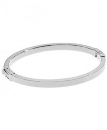 Complement your look with the perfect finishing touch. Michael Kors' polished bangle features a silver tone mixed metal setting and easy-to-use hinge clasp. Approximate diameter: 2-1/4 inches. Approximate width: 1/8 inch.