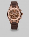 A sporty, yet chic timepiece with technical appeal in warm rose goldtone and complementary silicone. Quartz movementWater resistant to 5 ATMRound rose goldtone stainless steel case, 40mm (1.6) Logo etched bezelBrown chronograph dialNumeric hour markersSecond hand Brown silicone strapImported