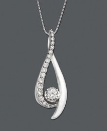 As fluid as liquid, this smooth pendant has all the right curves. Necklace features round-cut diamond (1/4 ct. t.w.) in a 14k white gold setting. Approximate length: 18 inches. Approximate drop: 1 inch. As fluid as liquid, this smooth pendant has all the right curves. Necklace features round-cut diamond (1/4 ct. t.w.) in a 14k white gold setting. Approximate length: 18 inches. Approximate drop: 1 inch.
