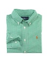 A handsome long-sleeved sport shirt is rendered in crisp gingham woven cotton broadcloth.