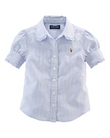 A preppy cotton striped oxford shirt with signature pony embroidery is styled with a ruffled collar and puffed sleeves for a pretty look. A preppy cotton striped oxford shirt with signature pony embroidery is styled with a ruffled collar and puffed sleeves for a pretty look.