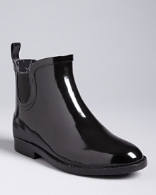 Take a shortcut to slick style on your next rainy day in these high-gloss, Chelsea-style rain boots by Ted Baker.