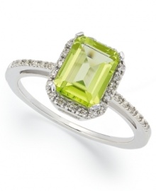 A green sensation. This unique emerald-cut peridot ring (2 ct. t.w.) stands out against a halo of round-cut diamond accents. Set in 10k white gold. Size 5, 5-1/2, 6, 6-1/2, 7, 7-1/2, and 8.