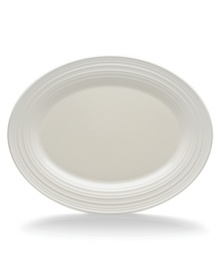 With the natural appeal of hand-thrown pottery, the Swirl White oval platter achieves unfussy elegance in classic stoneware. Coordinates with Mikasa white dinnerware. The dishes have a smooth, glossy surface that contrasts the matte ribbed exterior for dynamic casual tables. With the natural appeal of hand-thrown pottery, the Swirl White oval platter achieves unfussy elegance in classic stoneware. Coordinates with Mikasa white dinnerware. The dishes have a smooth, glossy surface that contrasts the matte ribbed exterior for dynamic casual tables.