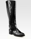 An edgy chain backs this equestrian-inspired leather silhouette, layered with adjustable buckle straps. Stacked heel, 1¼ (30mm)Shaft, 17Leg circumference, 15Leather upperPull-on styleLeather lining and solePadded insoleImported