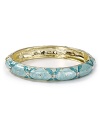 Aqua puts an on-trend spin on this season's global influences with this enamel bangle. It's bold print and sparkly stones are sure to stand out on a eclectic wrist.