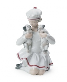 The essence of adorable, a little girl cuddles with two Dalmation puppies in this irresistible Lladro figurine of delicately glazed porcelain. The essence of adorable, a little girl cuddles with two Dalmation puppies in this irresistible Lladro figurine of delicately glazed porcelain.