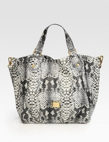 Sleek snake-print design lends a touch of exotic to this roomy PVC carryall, finished with polished goldtone hardware.Double top handles, 7 dropRemovable adjustable shoulder strap, 19-23 dropMagnetic top closureOne inside zip pocketTwo inside open pocketsLogo-print nylon lining20W X 12H X 5DImported Sleek snake-print design lends a touch of exotic to this roomy PVC carryall, finished with polished goldtone hardware.Double top handles, 7 dropRemovable adjustable shoulder strap, 19-23 dropMagnetic top closureOne inside zip pocketTwo inside open pocketsLogo-print nylon lining20W X 12H X 5DImported