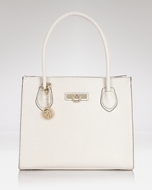 A round the clock wardrobe requires hard working accessories like this spacious tote from DKNY. Crafted from leather with perfect proportions, it's practically perfect (or perfectly practical.) A round the clock wardrobe requires hard working accessories like this spacious tote from DKNY. Crafted from leather with perfect proportions, it's practically perfect (or perfectly practical.)