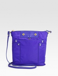 An easy shape made of sturdy nylon, featuring a signature logo and front patch pockets. Adjustable shoulder strap, 20-23¼ dropTop zip closureThree outside open pocketsOne inside zip pocketTwo inside open pocketsFully lined9½W X 10H X ½DImported An easy shape made of sturdy nylon, featuring a signature logo and front patch pockets. Adjustable shoulder strap, 20-23¼ dropTop zip closureThree outside open pocketsOne inside zip pocketTwo inside open pocketsFully lined9½W X 10H X ½DImported