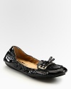 Stretchy patent leather with a dainty bow embellishment. Patent leather upperLeather lining and solePadded insoleMade in Italy