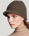 This sporty knit hat with brim is perfect for the slopes on a snowy day.