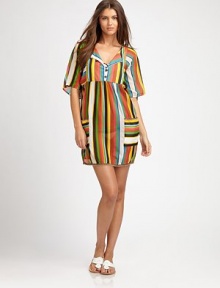 A coverup inspired by the tropics with coconut buttons, natural jute trim and bright colors.Button placketShort sleevesPull-on styleFront pockets74% cotton/26% silkDry cleanMade in USA of imported fabric A coverup inspired by the tropics with coconut buttons, natural jute trim and bright colors.Button placketShort sleevesPull-on styleFront pockets74% cotton/26% silkDry cleanMade in USA of imported fabric