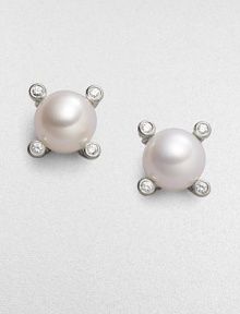From the Cable Pearl Wrap Collection. Four sparkling diamonds emerge from a cabled setting of sterling silver, surrounding a lustrous pearl. 6mm white cultured freshwater pearl Diamonds, 0.04 tcw Sterling silver Diamter, about ¼ Post back Imported From the Cable Pearl Wrap Collection. Four sparkling diamonds emerge from a cabled setting of sterling silver, surrounding a lustrous pearl. 6mm white cultured freshwater pearl Diamonds, 0.04 tcw Sterling silver Diamter, about ¼ Post back Imported