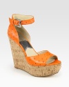 Rustic cork wedge topped with an ostrich-print leather upper and adjustable ankle strap. Cork wedge, 5 (125mm)Cork platform, 1½ (40mm)Compares to a 3½ heel (90mm)Ostrich-print leather upperLeather lining and solePadded insoleImported