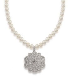 A glamorous floral pendant features a glittering array of crystals on this necklace from Carolee. Crafted with glass pearls and set in silver tone mixed metal. Approximate length: 18 inches + 2-inch extender. Approximate drop: 2 inches.