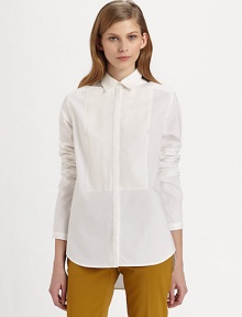 Classic button-down shirt renewed by a notched bib detail, hi-lo hem and silk trim. Point collarButton frontLong sleevesHi-lo hemBody: 95% cotton/5% polyurethane; Contrast: SilkDry cleanImportedModel shown is 5'10 (177cm) wearing US size 2.