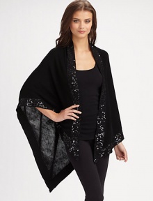 Fine gauge knit with hand beaded sequin border.One size fits most About 56 X 72 70% acrylic/30% wool Dry clean Imported Fine gauge knit with hand beaded sequin border.One size fits most About 56 X 72 70% acrylic/30% wool Dry clean Imported