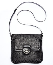 Step up your style status with this logo-splashed lovely from Nine West. Outfitted with the iconic 9's monogram, gleaming hardware and pockets aplenty, the hands free design provides on-the-go ease. Step up your style status with this logo-splashed lovely from Nine West. Outfitted with the iconic 9's monogram, gleaming hardware and pockets aplenty, the hands free design provides on-the-go ease.