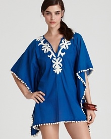 This caftan-style coverup from Ondademar features bohemian embroidery and pom-pom trim. Add a vibrant silk scarf for a head-to-toe holiday look. This caftan-style coverup from Ondademar features bohemian embroidery and pom-pom trim. Add a vibrant silk scarf for a head-to-toe holiday look.