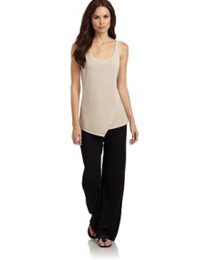 THE LOOKScoopneckSleevelessAsymmetric mock wrap detail in frontTHE FITAbout 26 from shoulder to hemTHE MATERIAL62% polyester/33% rayon/5% spandexCARE & ORIGINMachine washImportedModel shown is 5'11 (179cm) wearing US size Small. THE LOOKScoopneckSleevelessAsymmetric mock wrap detail in frontTHE FITAbout 26 from shoulder to hemTHE MATERIAL62% polyester/33% rayon/5% spandexCARE & ORIGINMachine washImportedModel shown is 5'11 (179cm) wearing US size Small.