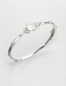From the Superstud Collection. A graceful bangle of bright sterling silver is dotted with pointy studs and highlighted by a faceted cushion of mother-of-pearl layered with clear quartz for a luminous effect.Mother-of-pearl and clear quartzRhodium-plated sterling silverDiameter, about 2.25Box-and-tongue claspImported