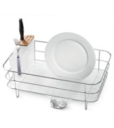 Reclaim your kitchen and keep your dishes spotless. This slim simplehuman dish rack features a slim design that opens up more valuable work space by incorporating a built-in drip tray and spout that empties directly into the sink -- no more ugly, bulky mats to cover up your precious counter space! Five-year warranty.