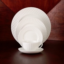 Simple shapes of crisp white are accented with precisely etched lines. Contrasting black matte jasper accessories with glazed interiors are also available. Bone china. Simple shapes of crisp white are accented with precisely etched lines. Contrasting black matte jasper accessories with glazed interiors are also available. Bone china.