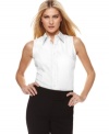 This classic petite shirt features a sleeveless silhouette and a tailored fit, from Jones New York Signature. Made from easy-care cotton, it stays looking fresh all day long!