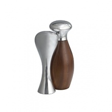 A splendid example of functional beauty, this exquisite set evokes a life well-lived, surrounded by deeply pleasing, well-made objects. The salt shaker nestles into the pepper grinder for a gratifying balance of warm natural wood and polished Nambé alloy, with shapes that fit the fingers just so A splendid example of functional beauty, this exquisite set evokes a life well-lived, surrounded by deeply pleasing, well-made objects. The salt shaker nestles into the pepper grinder for a gratifying balance of warm natural wood and polished Nambé alloy, with shapes that fit the fingers just so