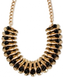 Become the center of attention. Haskell's unique frontal necklace features curled accents with black faceted beads. Crafted in gold tone mixed metal. Approximate length: 18 inches + 3-inch extender. Approximate drop: 1-3/8 inches.