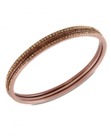 Subtle chic. Givenchy's bangle bracelet, crafted from rose gold-tone mixed metal, dazzles with light Colorado and smoked topaz tone glass accents. Approximate diameter: 2-1/2 inches.